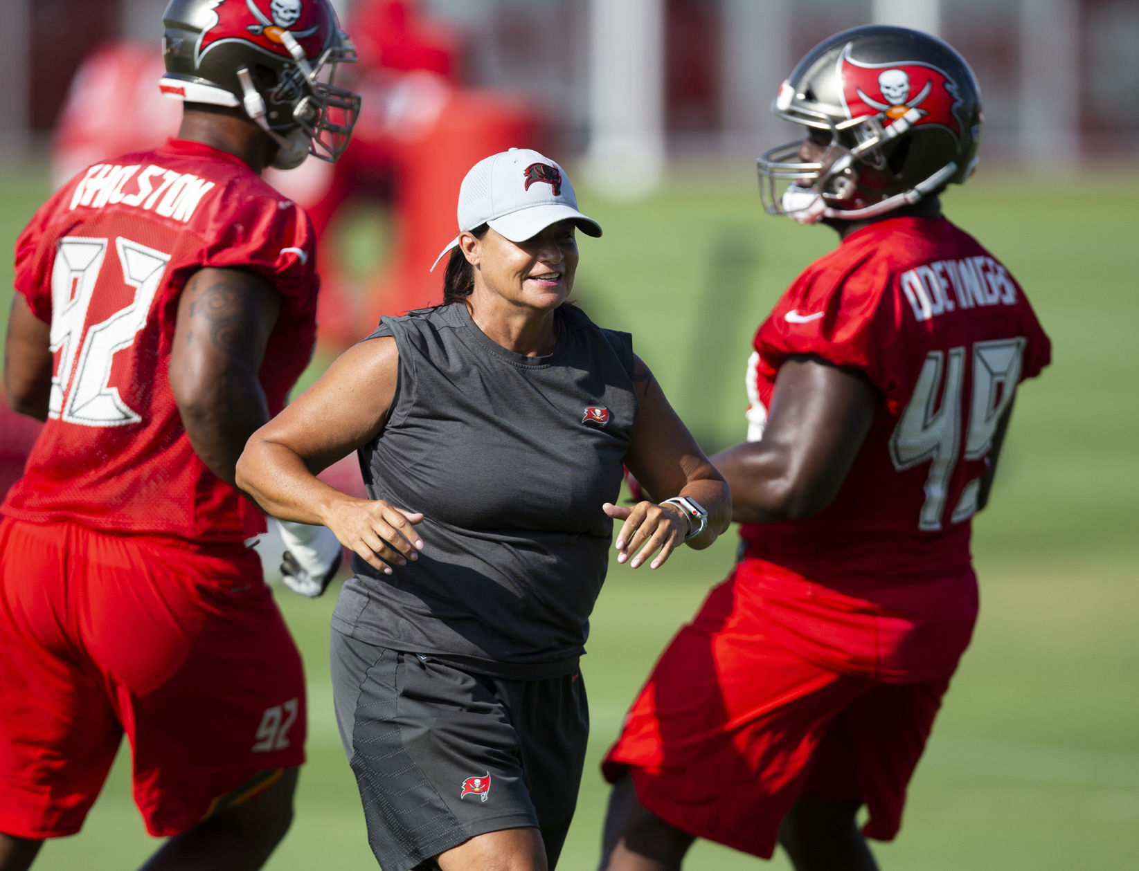 Tampa Bay Buccaneers assistant defensive line coach Lori Locust runs drills while on the field during mandatory mini-camp on June 5, 2019 at the AdventHealth Training Center in Tampa, Fla.